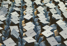 grads in cap and gown black