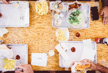 wood table with food and cafe trays