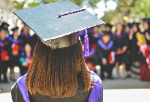 black cap and purple tassle graduation 